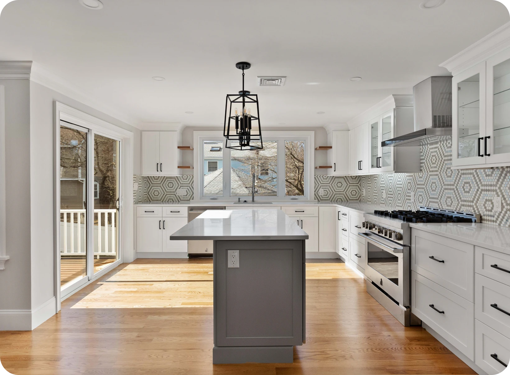 Modern kitchen with island and geometric tiles