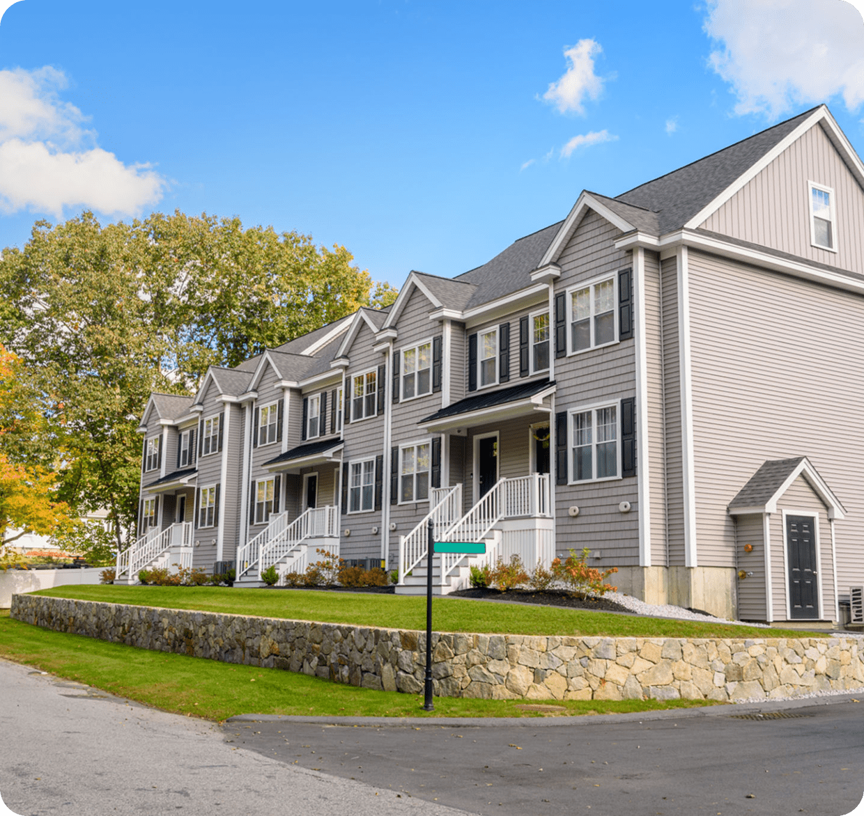 Gray townhomes on a sunny day